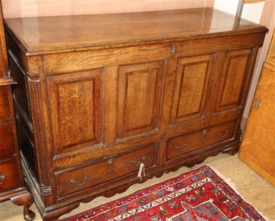 An 18th century oak and mahogany panelled mule chest W.132cm